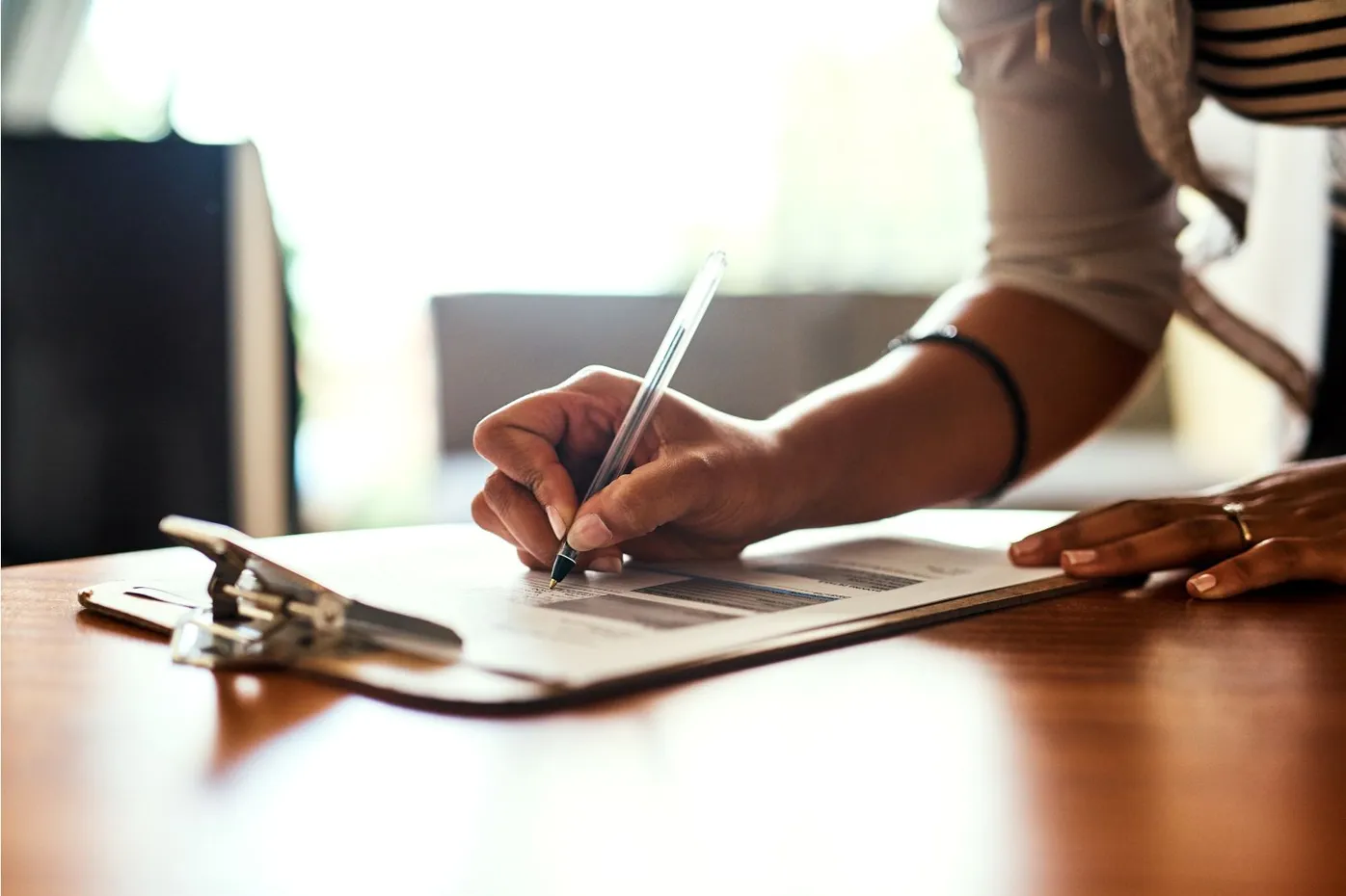 a woman filling her Luminiv Health patient form