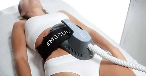 woman using emsculpt neo treatment to reduce belly fat